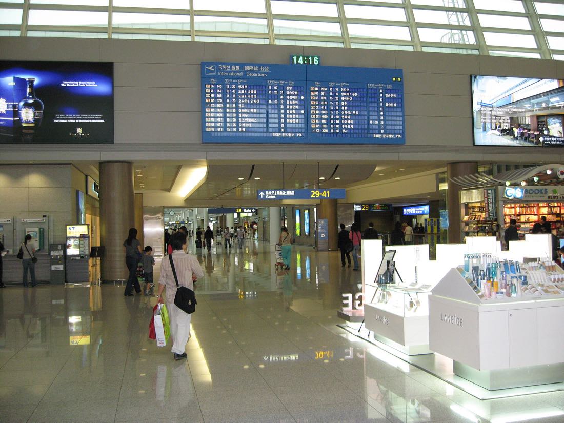 The departure hall and information boards at Incheon International Airport
